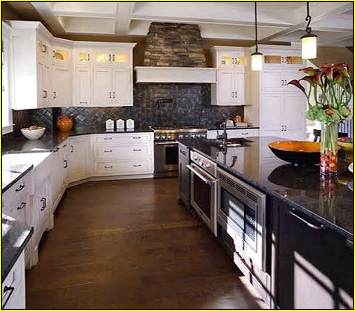 Kitchen With White Cabinets And Black Granite