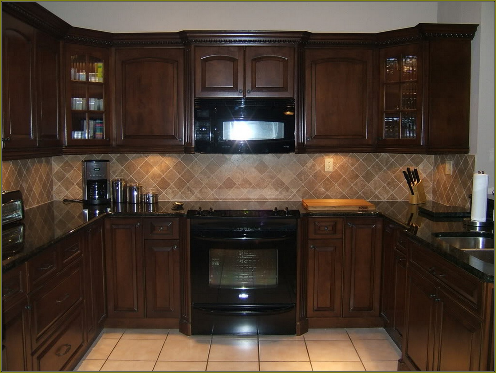 Cream Colored Kitchen Cabinets With Black Appliances