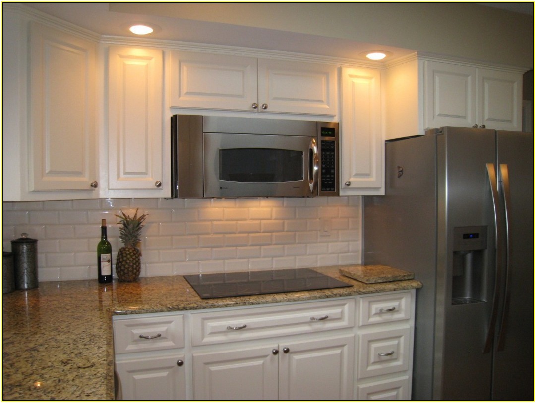 Kashmir Gold Granite With White Cabinets
