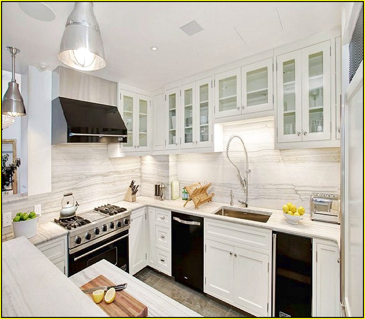 Kitchen With White Cabinets And Black Appliances