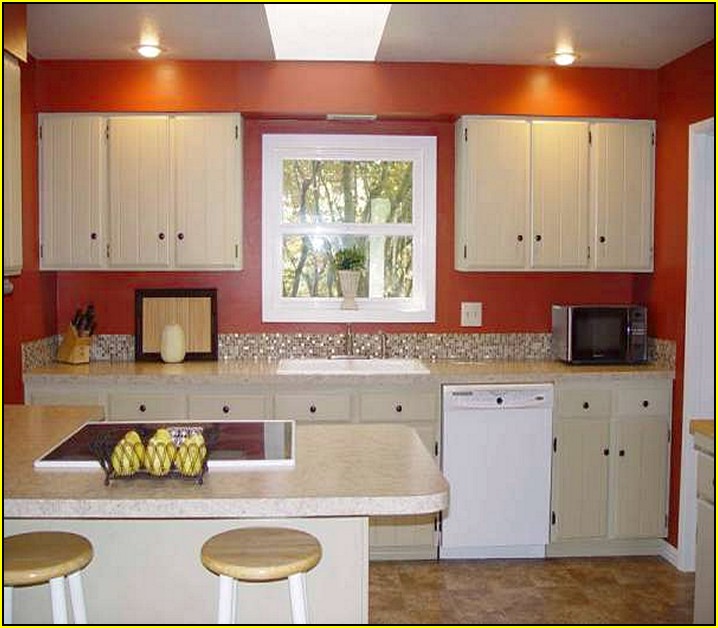 Kitchen With White Cabinets And Red Walls